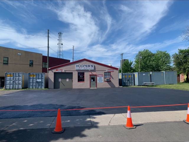 Freshly sealed lot in front of a tire shop